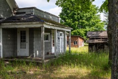 Old Gray Porch Distant Shacks