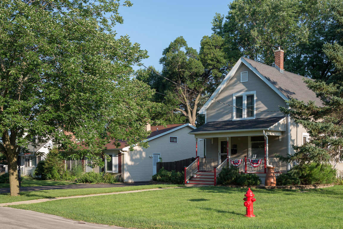 Houses - Porch with Bunting and Neighbor
